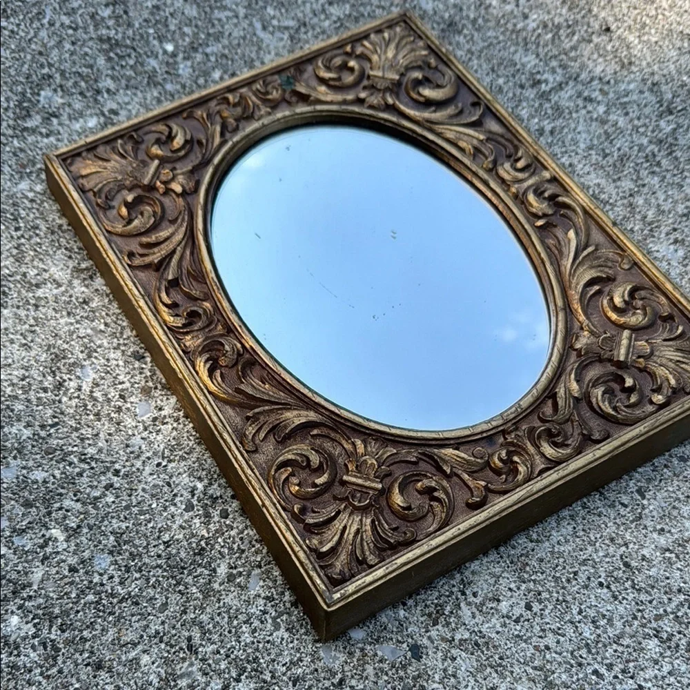 Gold Ornate Mirror with Intricate Scrollwork